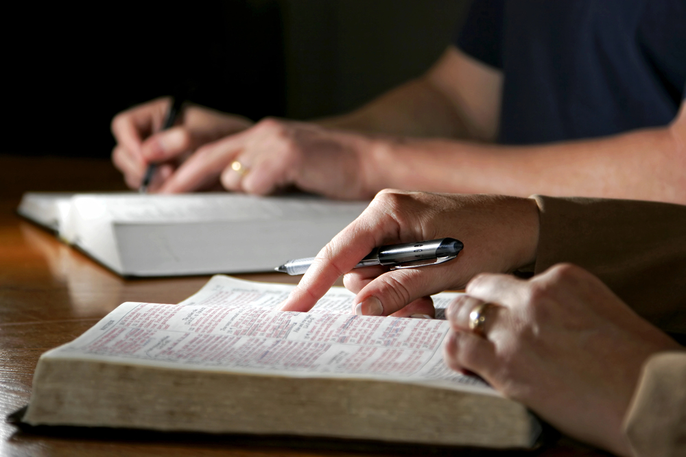 Man and Woman with Holy Bibles